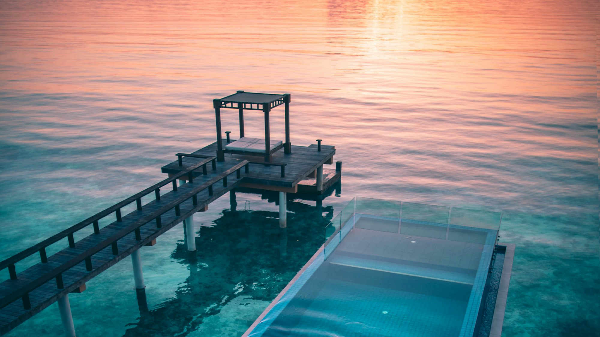 Infinity pool of a private villa at sunset