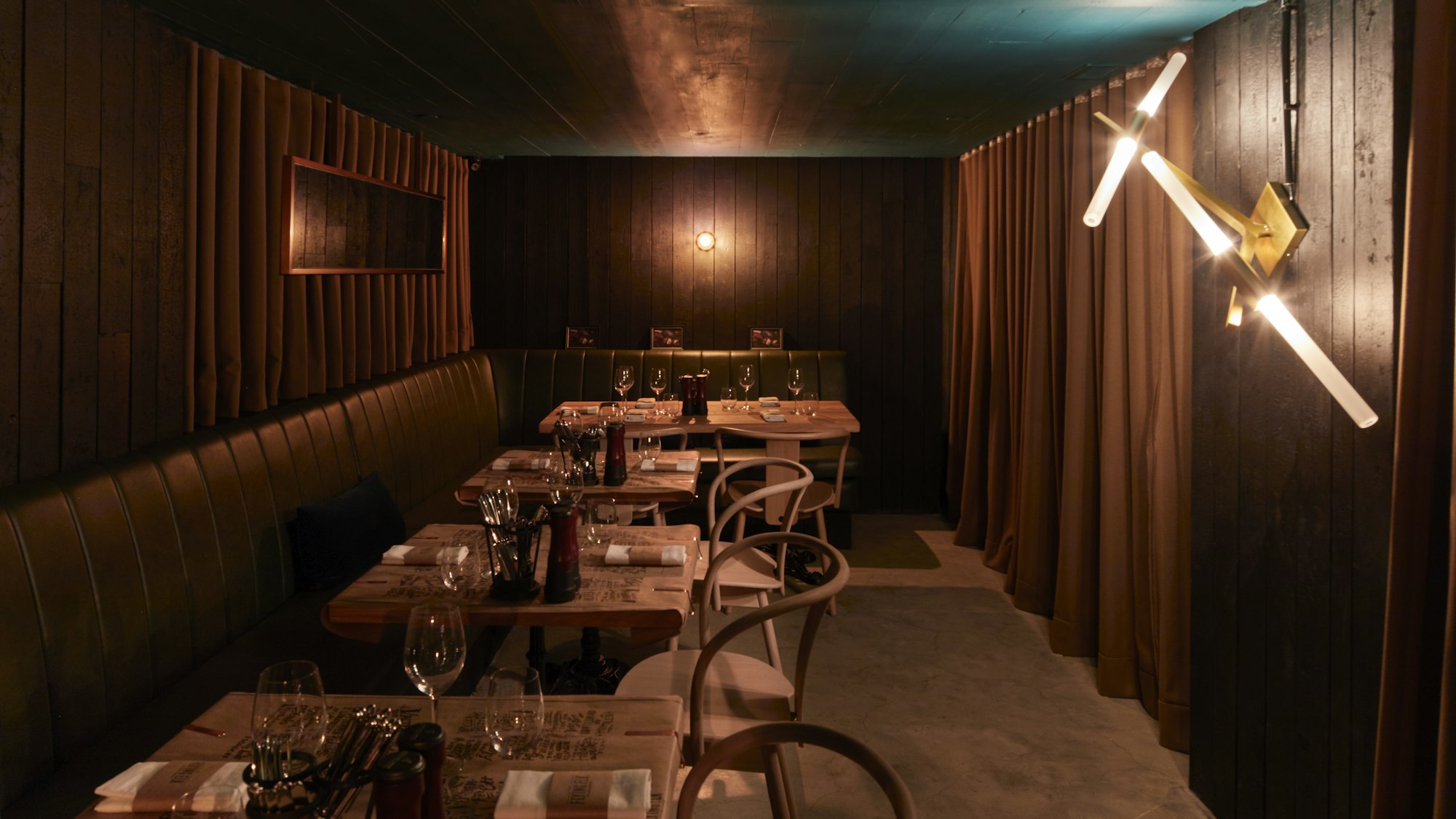 Candlelit dining room of a private restaurant